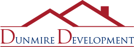 Company logo of dunmire development featuring stylized mountain peaks above the lettering.